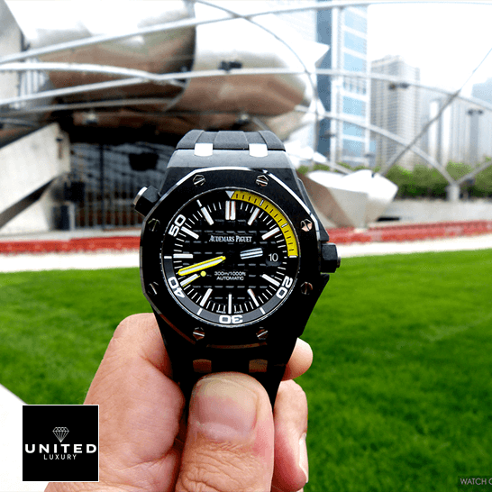 Audemars Piguet Royal Oak Offshore Diver 15706AU "Forged Carbon" Perfect Clone Edition audemars piguet royal oak offshore diver 15706AU.OO .A002CA.01 replica front Audemars Piguet Royal Oak Black and yellow Dial Replica grass background