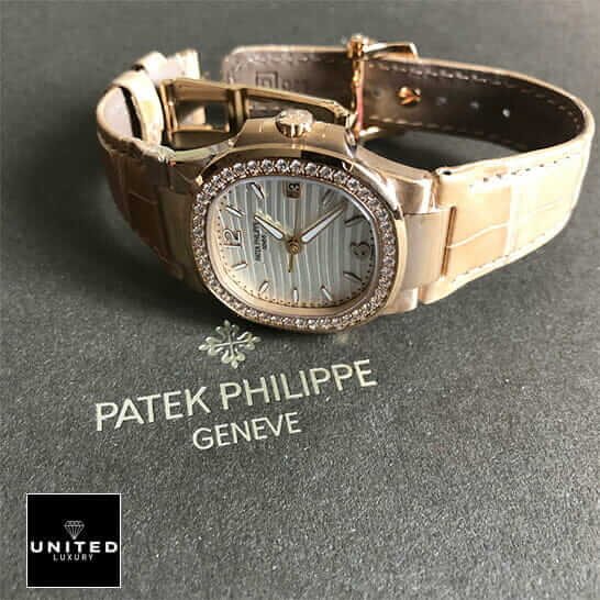 Patek Philippe Nautilus 7010R-011 "Silver Dial" High Fidelity Replica patek 7010r 011 replica 1 Patek Philippe 7010 Diamond Bezel Leather Bracelet Replica on the grey carpet