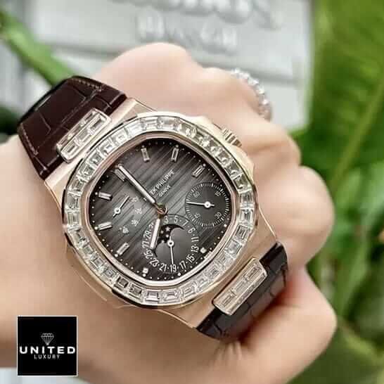 Patek Philippe Nautilus 5724 "Baguette Diamonds" 1:1 Clone Edition patek philippe baguette replica 4 Patek Philippe Gold Case Diamond Bezel Black Dial Replica on thhe hand
