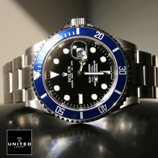 Rolex Submariner Date 16610 "Black Dial" Master Clone Quality rolex submariner 16610 replica tiltedleft Rolex Submariner Date 16610 Black Dial Oyster Replica on the table